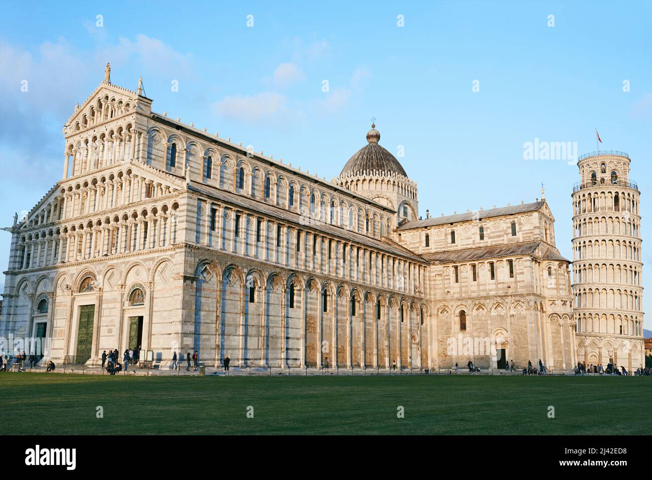 PISA, ITALY - OCTOBER 15, 2021: View to the Pisa Cathedral of the Assumption of the Blessed Virgin Mary - Cathedral of Pisa and leaning tower of Pisa Stock Photo