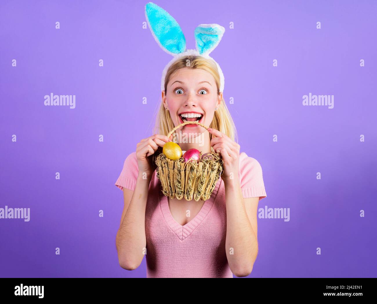 Happy easter woman with basket eggs. Bunny girl in rabbit ears. Spring holidays. Sale. Discount. Stock Photo