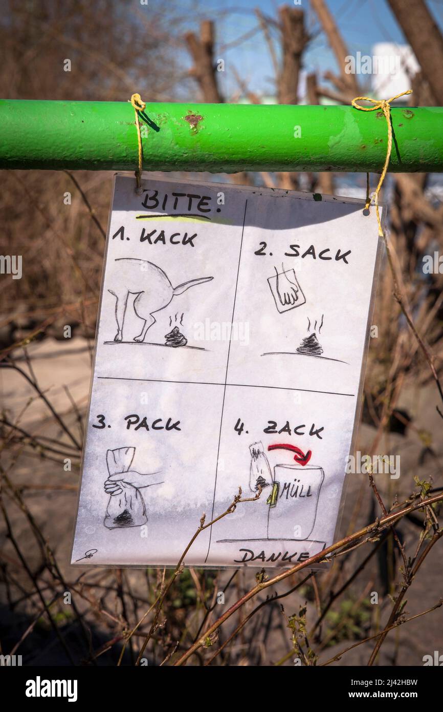 funny request to collect and take the droppings from the dog, Cologne, Germany. lustige Aufforderung, den Kot vom Hund einzusammeln und mitzunehmen, K Stock Photo