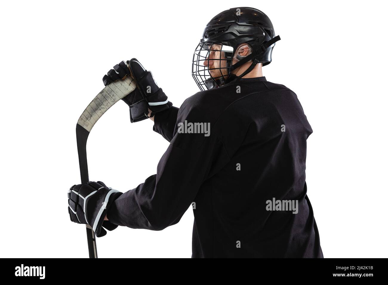 Back view portrait of professional hockey player posing isolated over