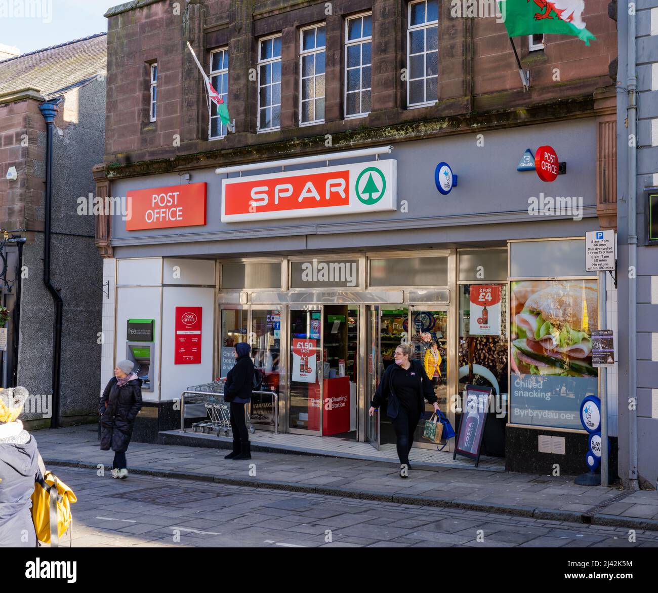 Conwy Wales UK April 2022 Spar mini market store front on the high street of the town Stock Photo