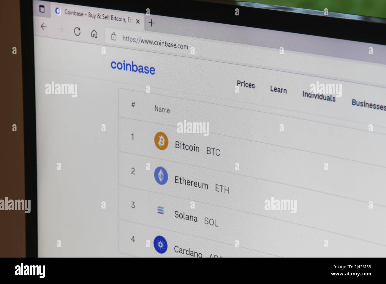 Coinbase crypto currency website screen showing Bitcoin BTC Ethereum ETH  Solana SOL Cardano ADA Stock Photo - Alamy