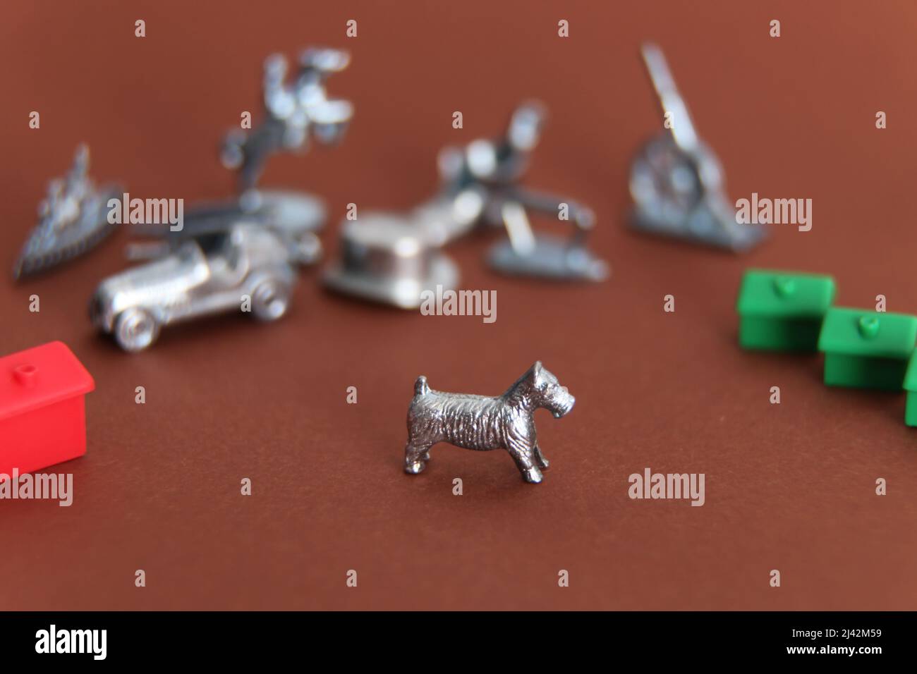 Monopoly games pieces with 1 dog icon piece in focus and other icons out of focus Stock Photo ...