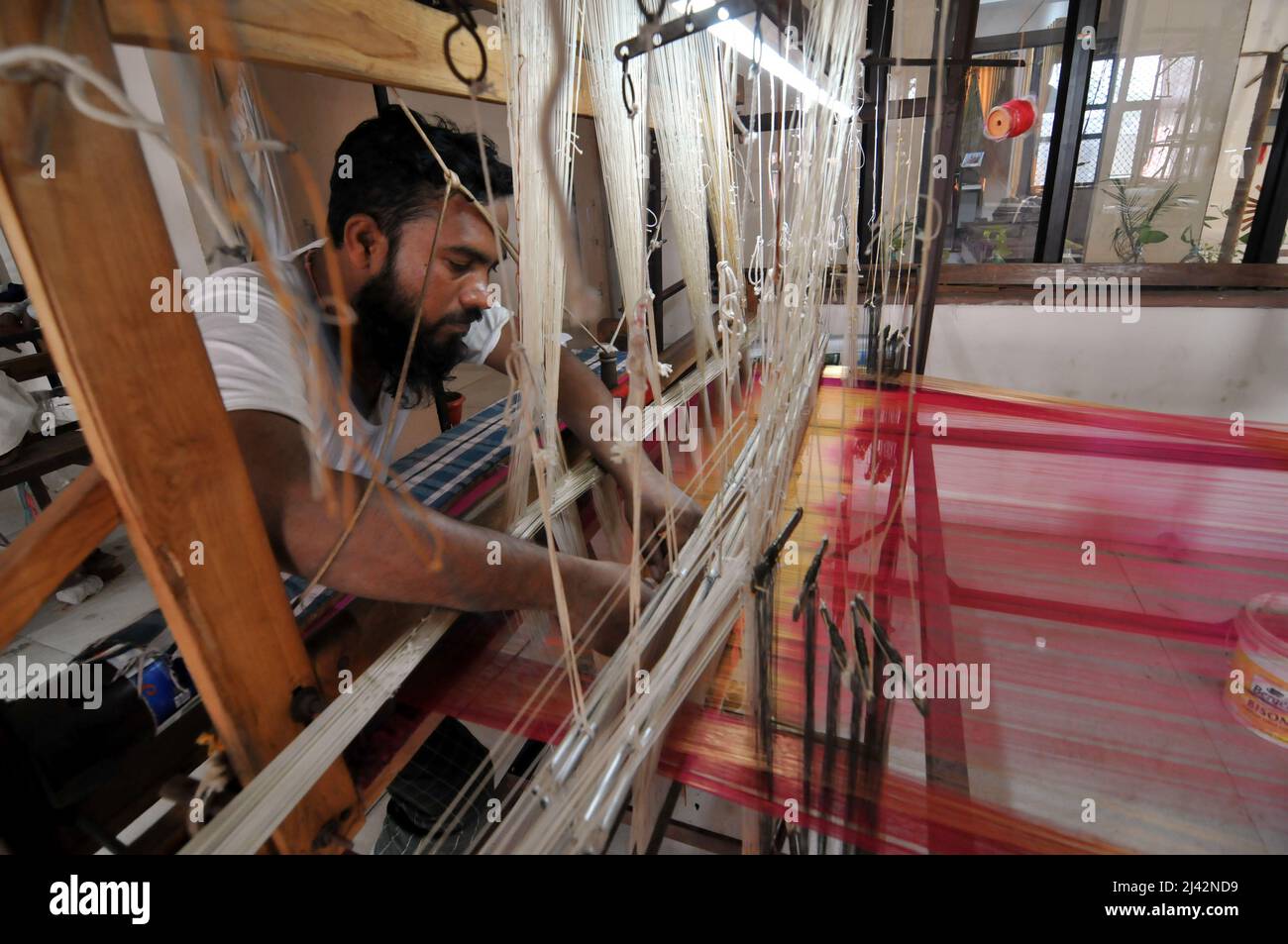 New Delhi, India. 11th Apr, 2022. Workers manufacture Chanderi Silk and Cotton Sarees by weaving in Chanderi Madhya Pradesh, near New Delhi, India on Apr. 11, 2022. Thousands of families work using traditional techniques such as pit looms and frame looms to make traditional world famous chanderi silk sarees. (Photo by Ravi Batr/Sipa USA) Credit: Sipa USA/Alamy Live News Stock Photo