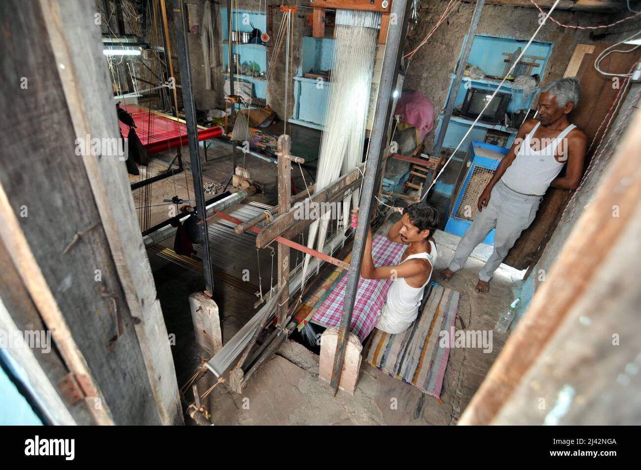 Workers manufacture Chanderi Silk and Cotton Sarees by weaving in ...