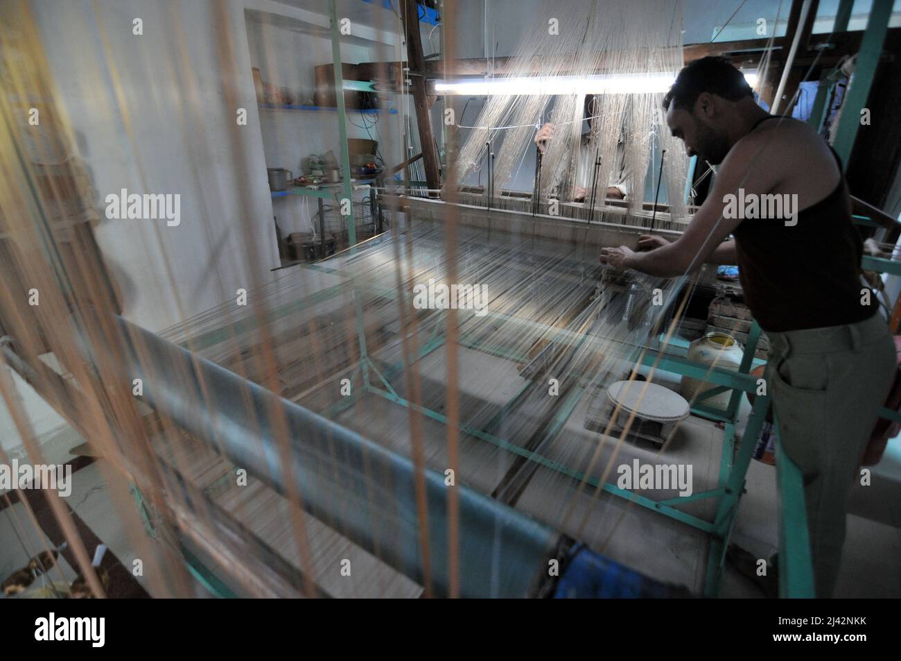 Workers manufacture Chanderi Silk and Cotton Sarees by weaving in ...