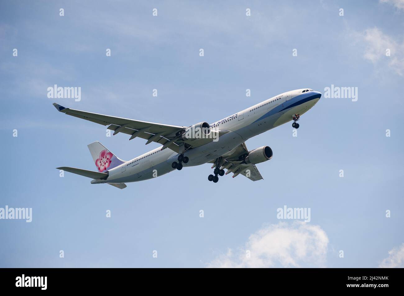 29.11.2021, Singapore, Republic of Singapore, Asia - China Airlines Airbus A330-300 passenger aircraft approaches Changi Airport for landing. Stock Photo