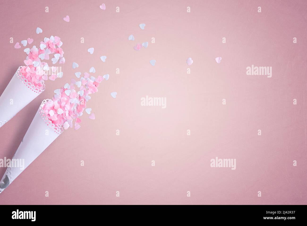 Biodegradable Wedding Confetti on a pink background with copy space Stock Photo