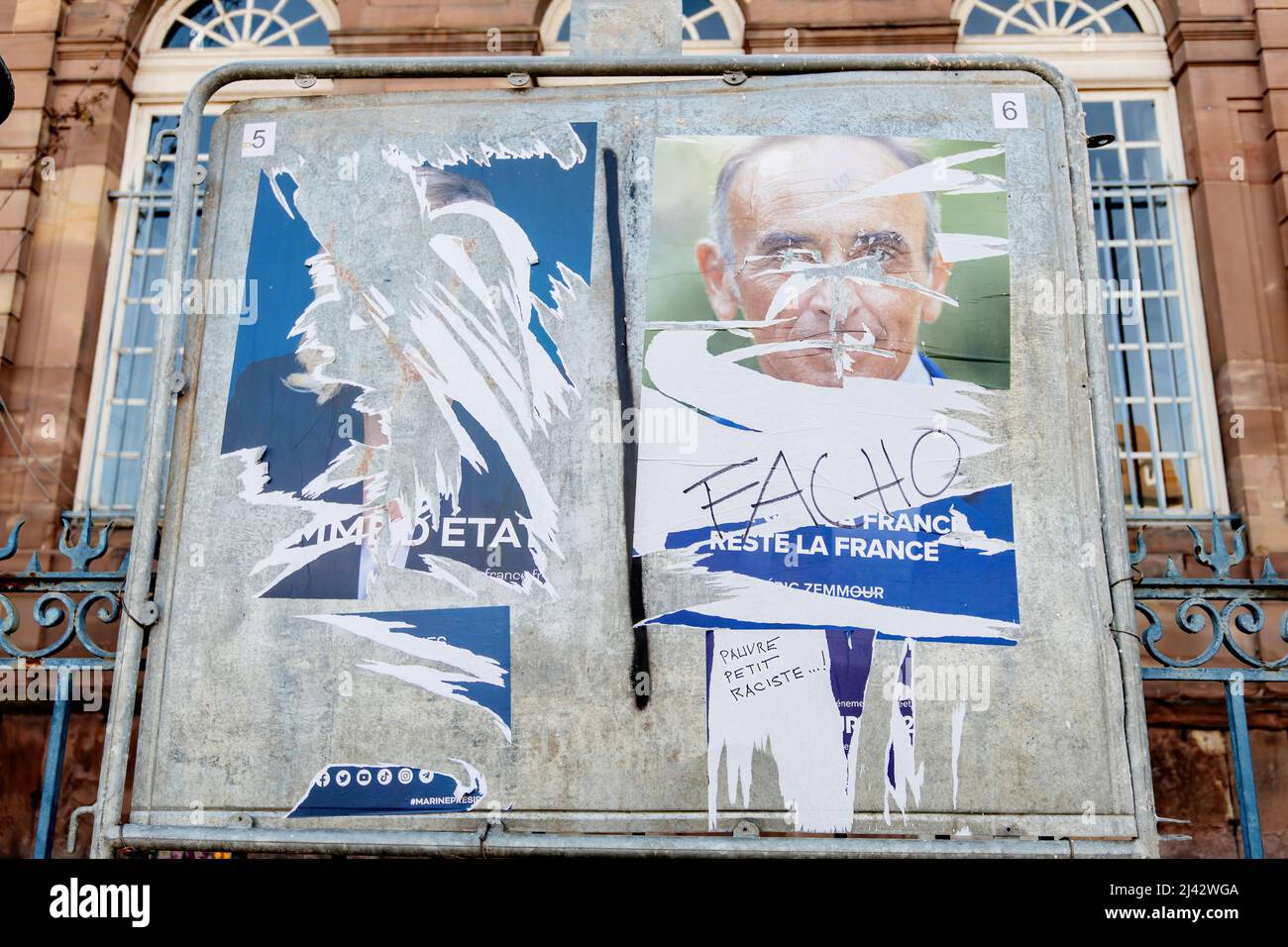 STRASBOURG, FRANCE - APR 23, 2022: French presidential posters for the upcoming presidential election in France, in front of the City Hall building in Strasbourg featuring Eric Zemour and Marine Le Pen Stock Photo