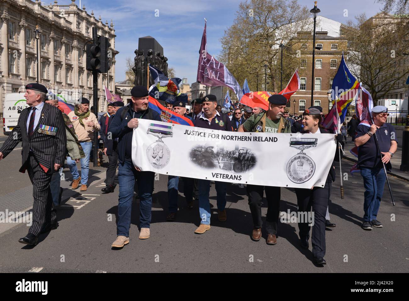 London, UK. 11th Apr, 2022. Protesters march with a banner saying 'Justice for Northern Ireland veterans' during the demonstration. Northern Ireland veterans and Justice for Northern Ireland campaign group, which lobby Parliament to stop historical investigations against NI veterans, marched through Whitehall in London, and blocked entrance to the Northern Ireland Office in Westminster. (Photo by Thomas Krych/SOPA Images/Sipa USA) Credit: Sipa USA/Alamy Live News Stock Photo