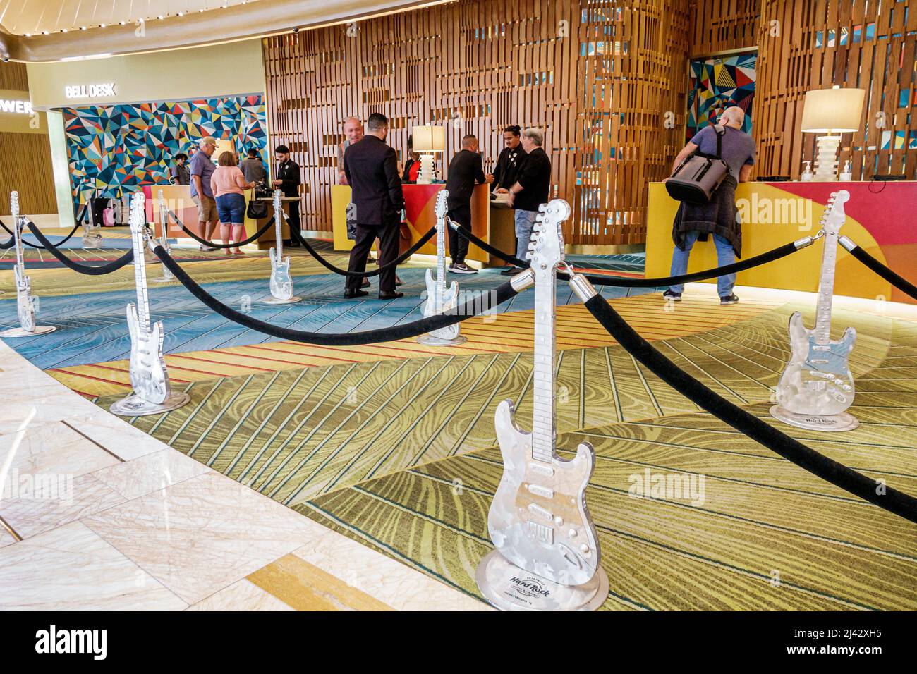 Hollywood Florida Seminole Hard Rock Hotel & Casino tribe tribal reservation inside interior lobby front check-in reception desk guests checking Stock Photo