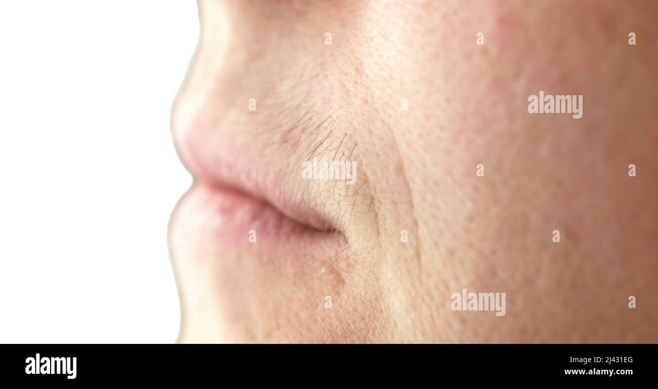 Female mustache close-up. Mustache above the upper lip of a woman, close-up, selective focus Stock Photo