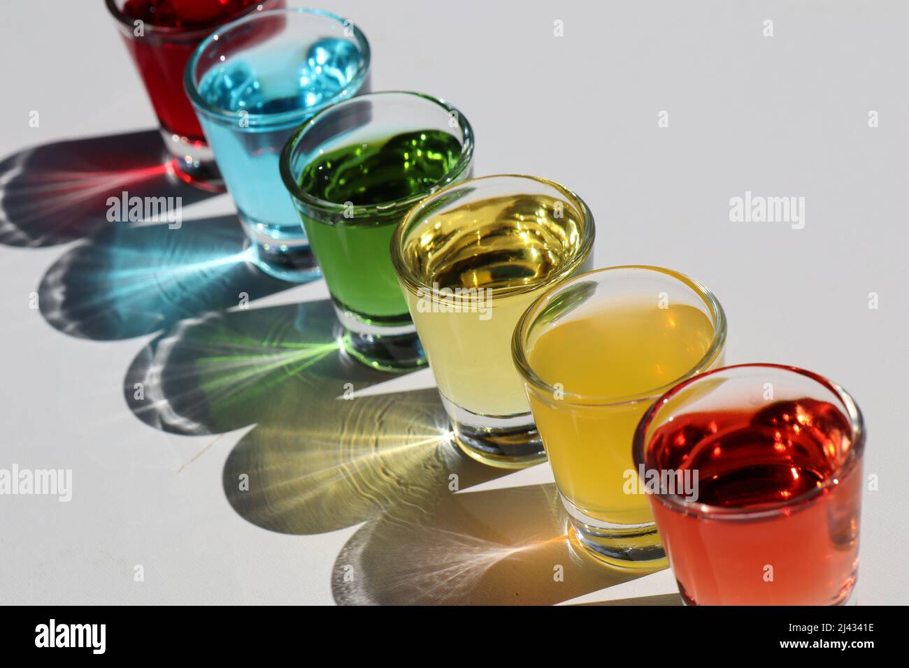Rainbow drinks glasses with shadows and light distortion Stock Photo