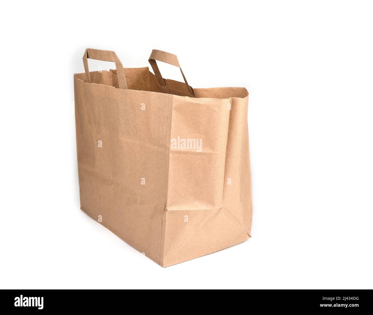 Empty Kraft paper bag on a white. Eco friendly packaging concept. Stock Photo