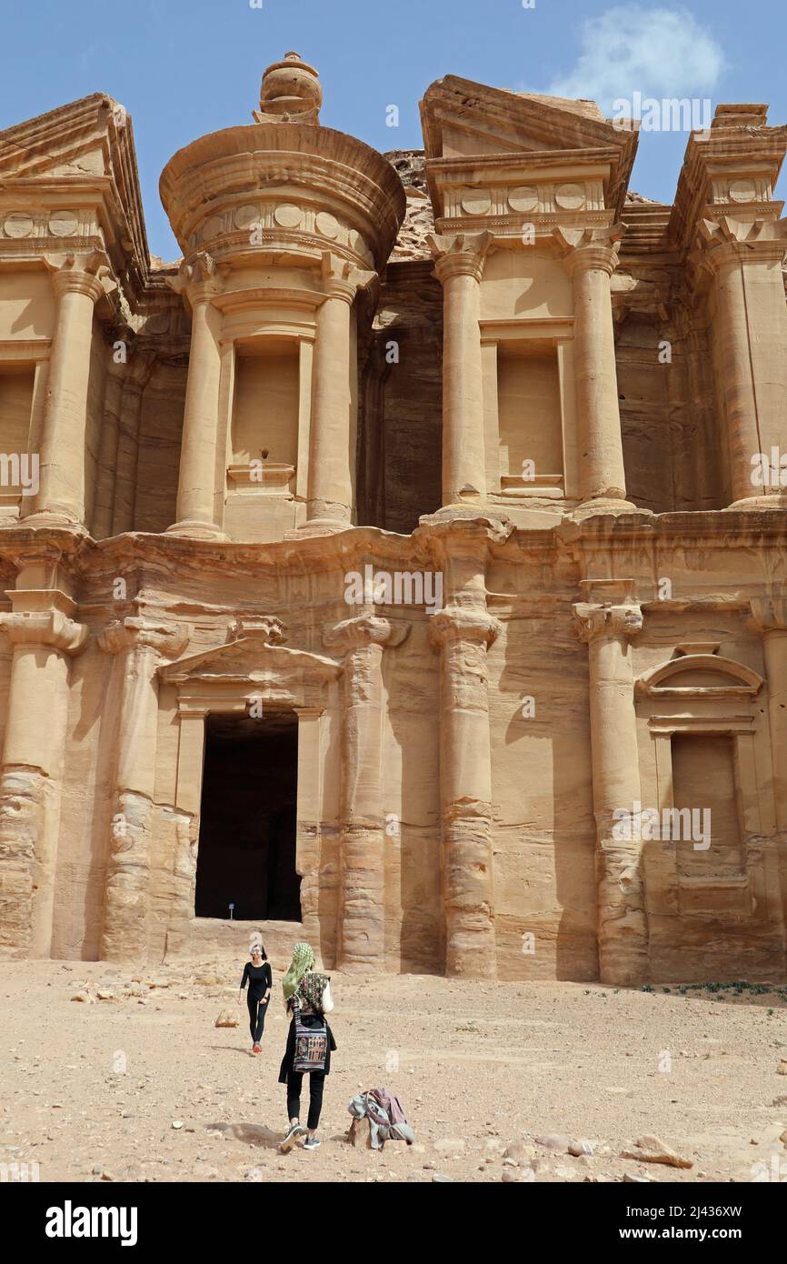 Tourists at The Monastery in Petra Stock Photo