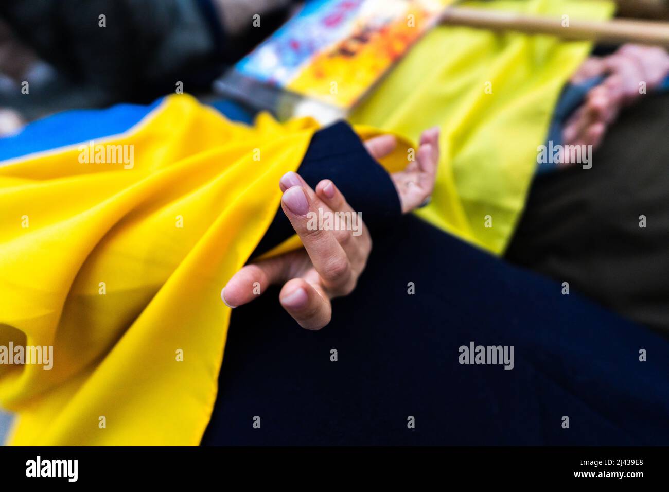 Evening, 7th April. Protesters tied up their hands near the Russian Embassy of London, to reenact the horror inflicted by the Russian Army. Stock Photo