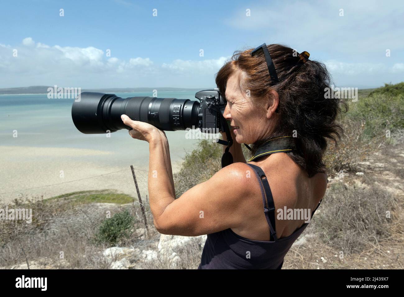 West Coast South Africa. 2022. Female photographer using a heavy camera