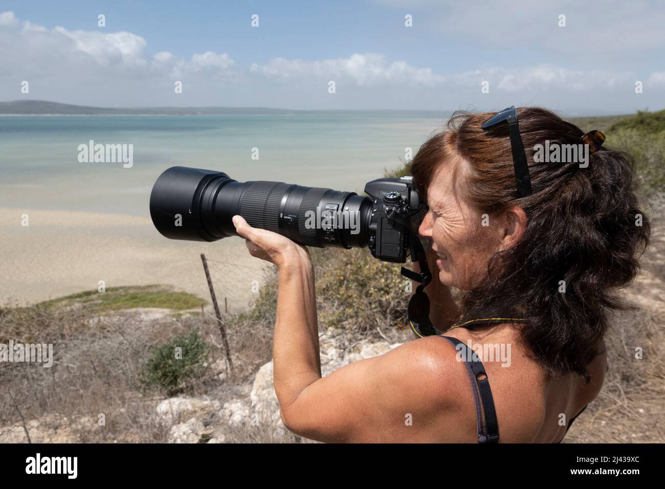 West Coast South Africa. 2022. Female photographer using a heavy camera