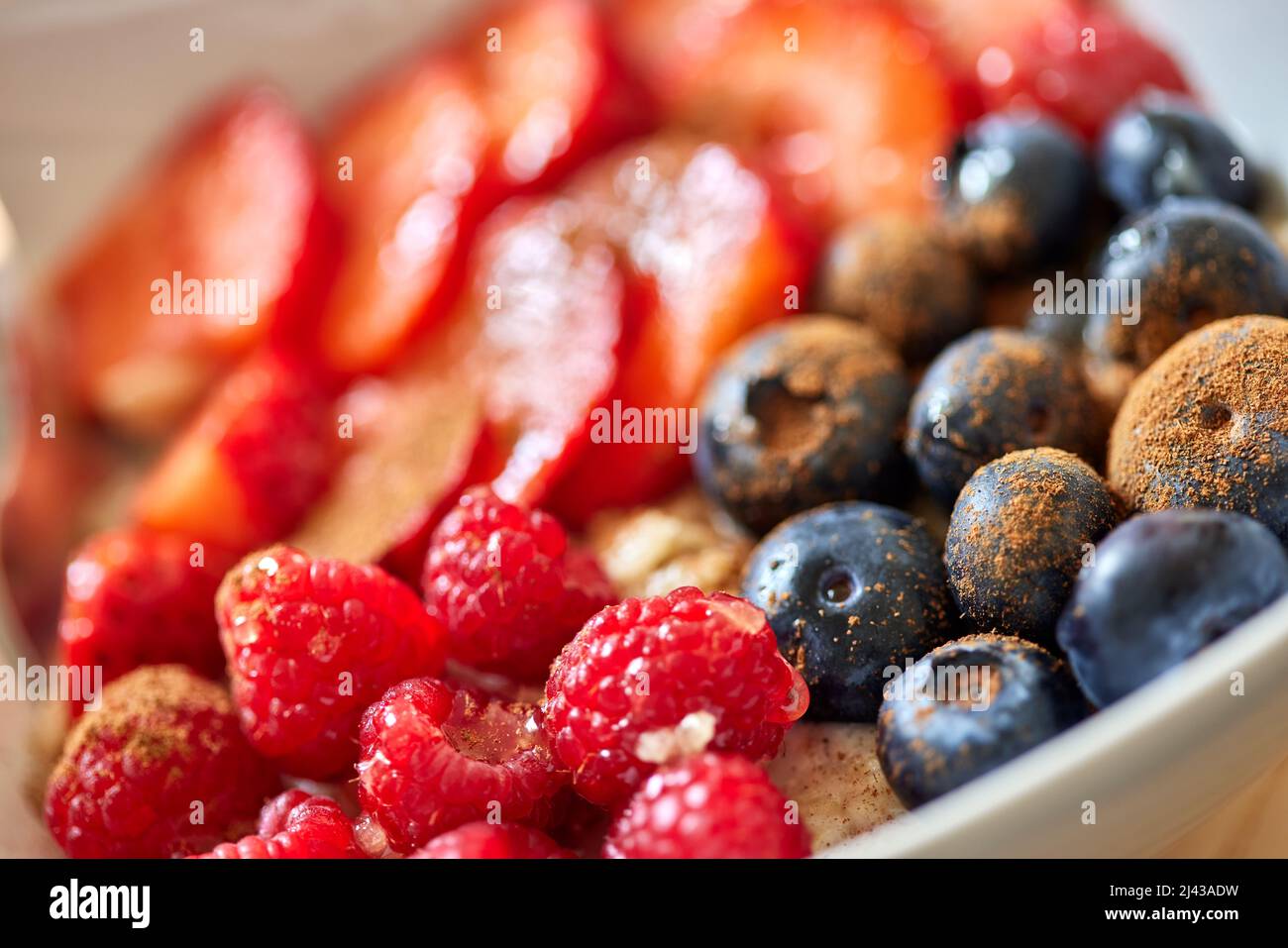 Oatmeal porridge with fruits and cinnamon - close up view Stock Photo