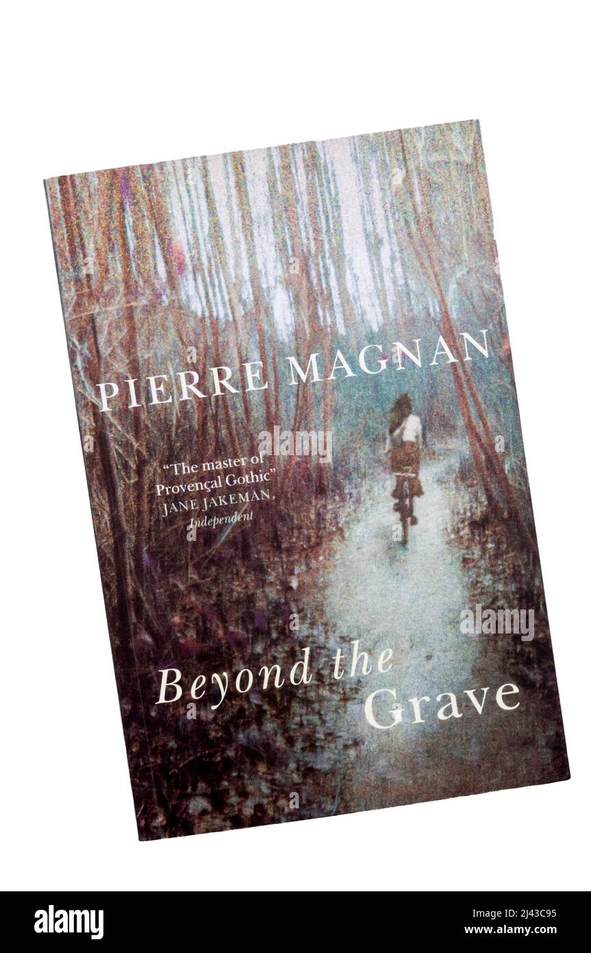 A paperback copy of Beyond the Grave by Pierre Magnan. Stock Photo