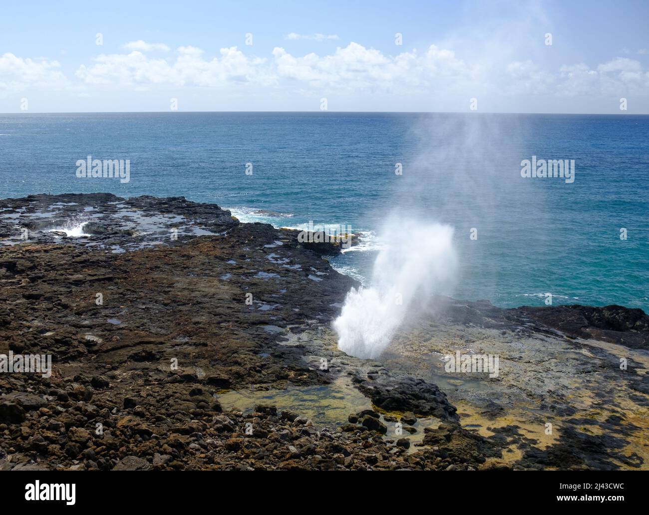 Surf blow hole in Kauai, Hawaii Stock Photo