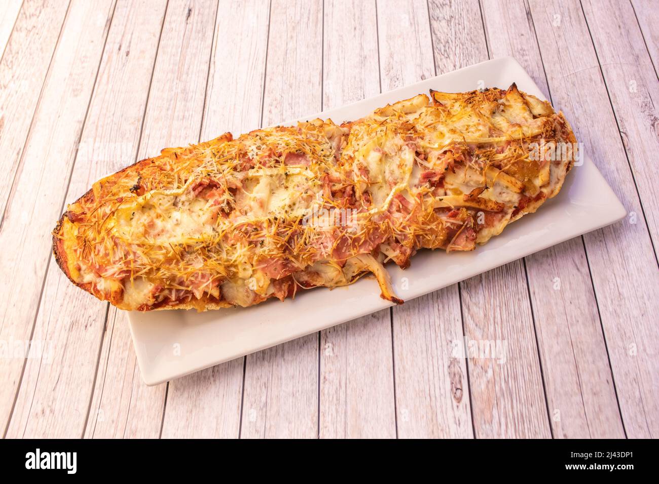 The panini or panino is a variety of sandwich of Italian origin, which has international distribution. A panino is usually made with a small roll or p Stock Photo