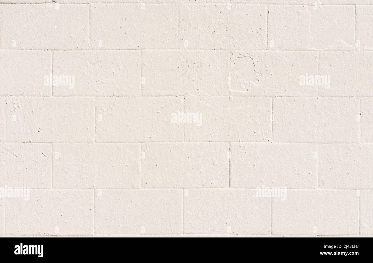 Painted old brick wall closeup, light cream color, background Stock Photo Alamy