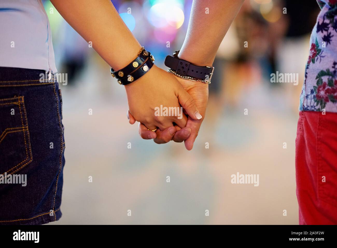 Ill always be by your side. Cropped shot of a couple holding hands while out in the city. Stock Photo