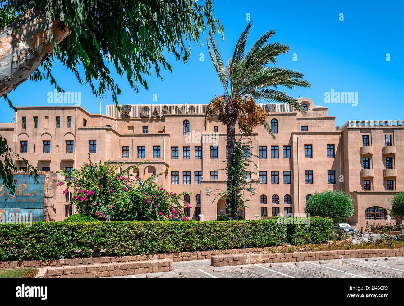 View of Grande Albergo delle Rose (Grand Hotel of Roses), a seaside luxurious hotel in the center of the city of Rhodes, Greece, housing the Casino. Stock Photo