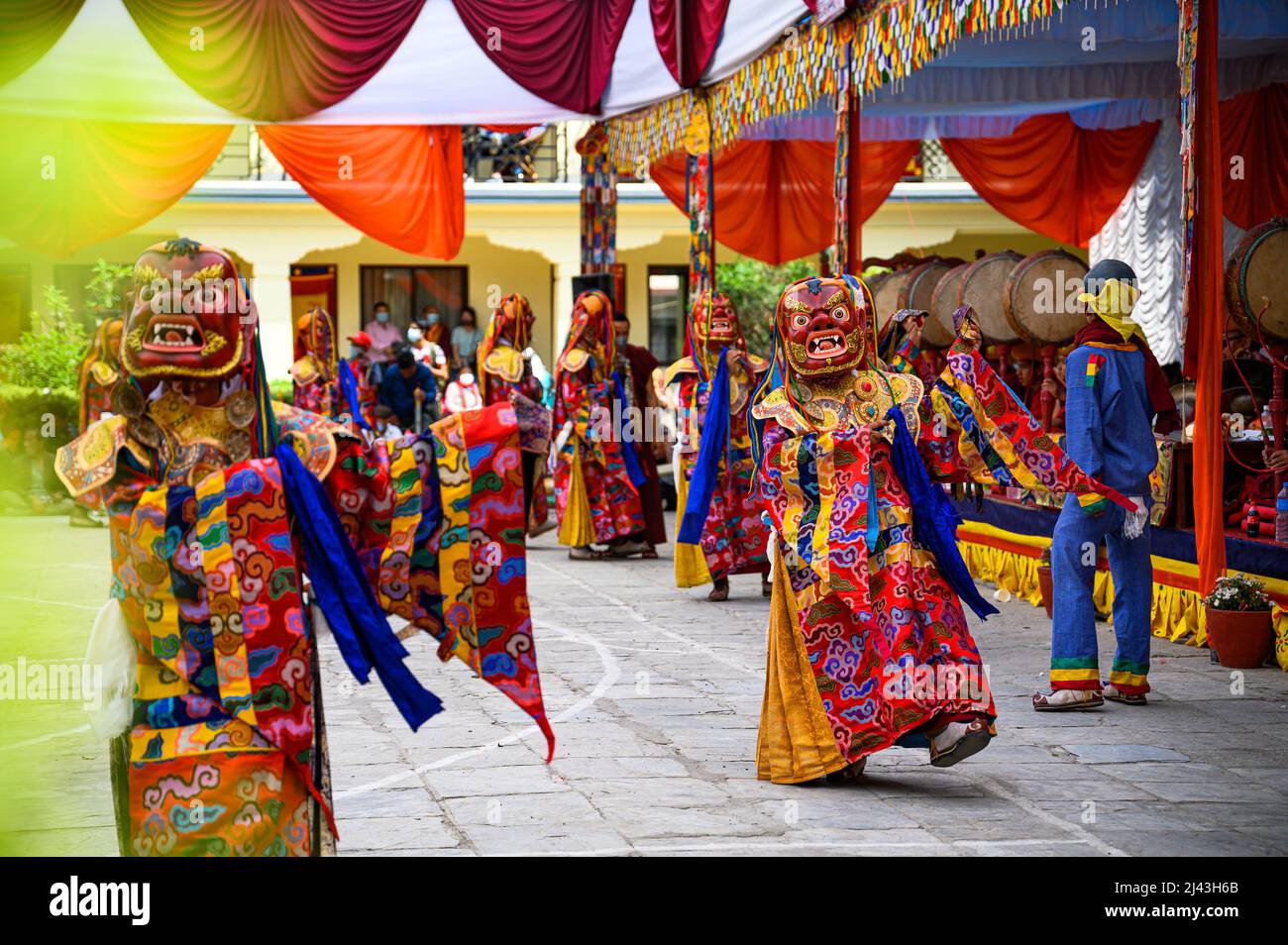 Masked dancers dressed in the traditional attire performe a spiritual ...