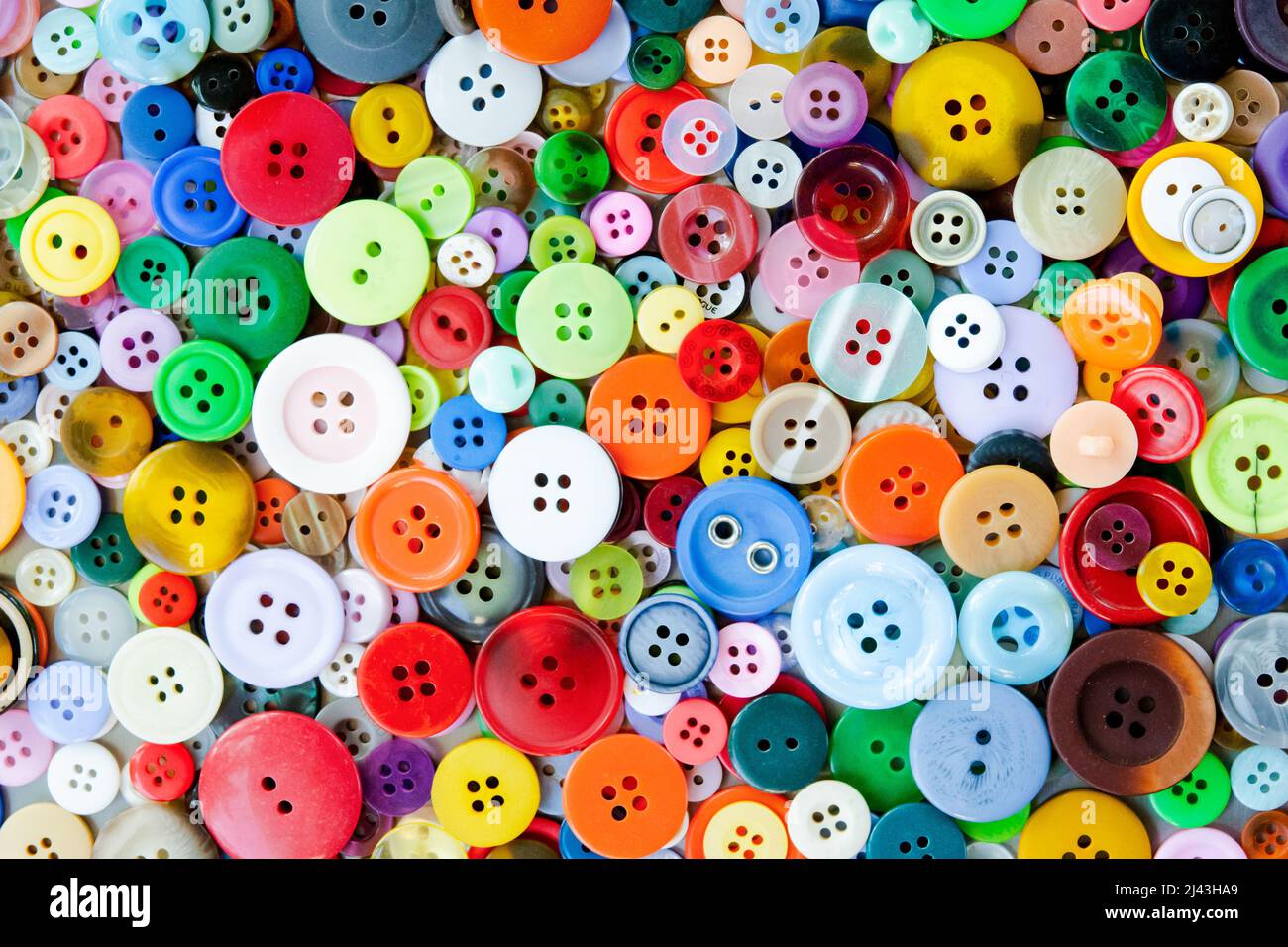 Colorful mixed sewing buttons background. Top view Stock Photo - Alamy
