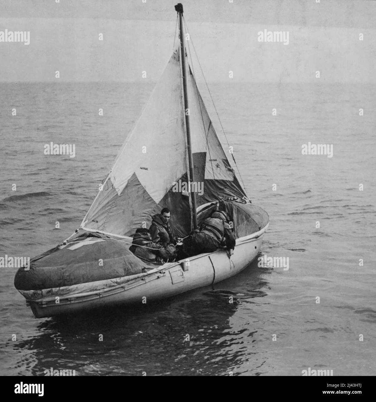 Rescue By Airborne Lifeboat -- Rescue from the sea by lifeboats dropped from aircraft is now a feature of the work of R.A.F. Coastal Command Air-Sea Rescue Service lifeboats, fitted with two-stroke engines, a height of 700ft, sails set and engines ready, a rescued crew sails for home. March 2, 1945. (Photo by Topical Press). Stock Photo