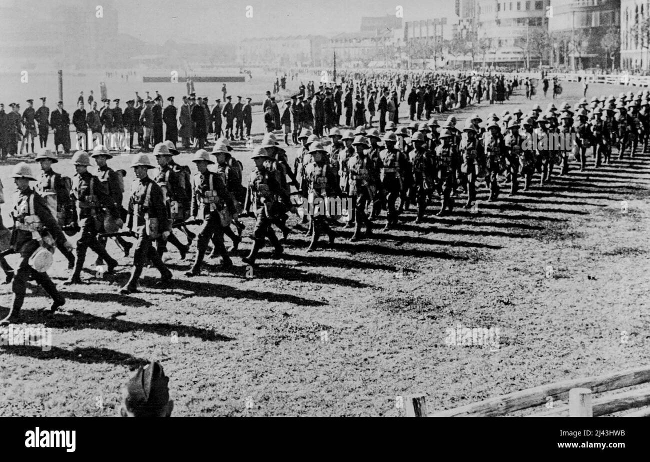British Troops Arrive At Shanghai To Relieve Defence Forces -- Men of the first battalion, Durham light infantry, are seen marching on to the race course here on arrival from Hong Kong. They relieved the royal Ulster rifles from British defence duty here during the Sino-Japanese War. December 14, 1937. (Photo by Associated Press Photo). Stock Photo