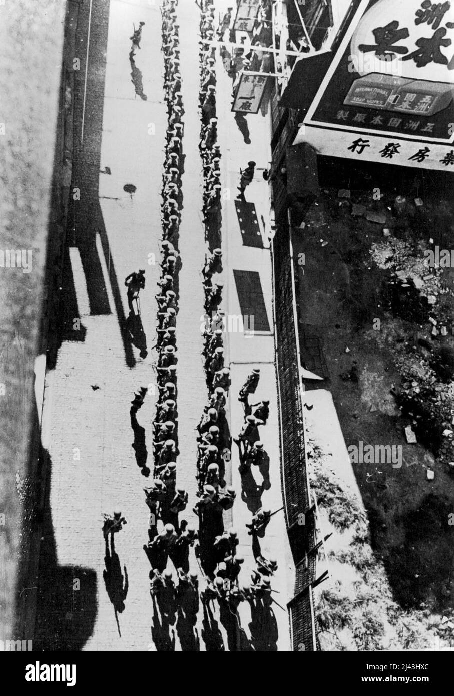 British Troops In International Settlement -- British troops in the International settlement in Shanghai, seen from above, while they are lined up and ready to go into the defence linese faching the Chinese and the Japanese. It was men like these who lost their lives recently while on duty at their posts in the settlement. November 15, 1937. (Photo by Associated Press Photo). Stock Photo