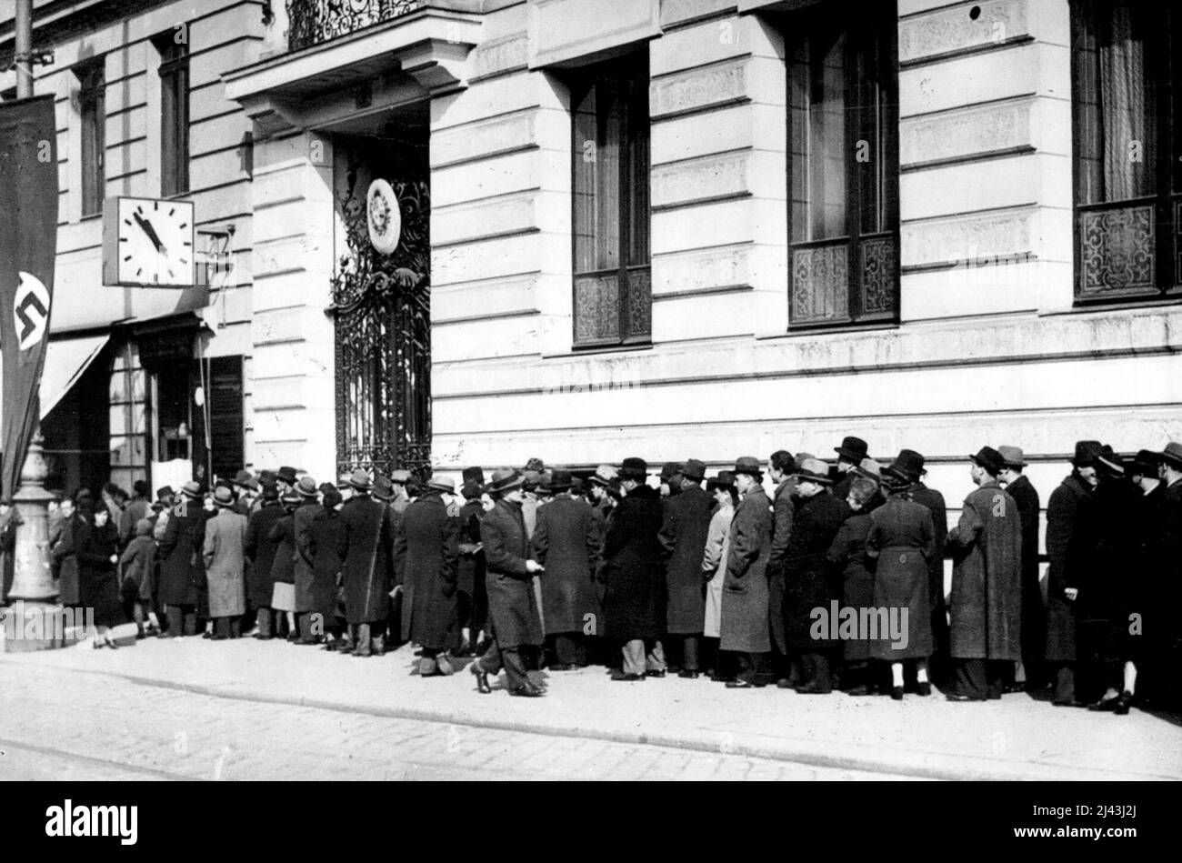 Jews Seek Escape From Vienna -- Part of the huge crowd gathered outside the polish legation in Vienna today, March 15, waiting to try and obtain visas to allow them to cross the border Int Poland. With the advent of Hitler here and the consequent fear of persecution, Jews are endeavouring to flee the country to Poland, and hundreds have already endeavoured to obtain visas from the polish legation here which will enable them to cross the border. September 10, 1938. (Photo by Associated Press Pho Stock Photo