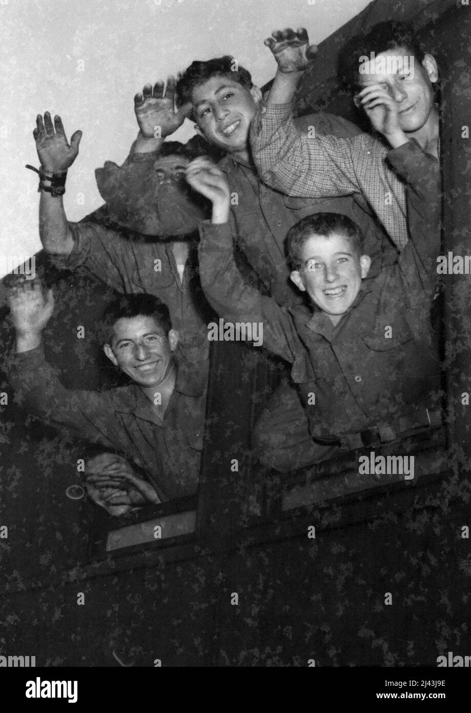 Some of The toungsters wave from the train on arriving at Gisors, France, all were inmates of the Notorious Buchenwald Horror camp. A trainload of youngsters, their ages ranging between 8 and 16 all of whom were liberated from the notorious horror camp at Buchenwald by the American, arrived at Gisors, France, yesterday June 8, later they were taken to Ecouis where they are to be cared for by the French Government until they are fit enough to return to their homes. July 16, 1945. (Photo by Associated Press Photo). Stock Photo