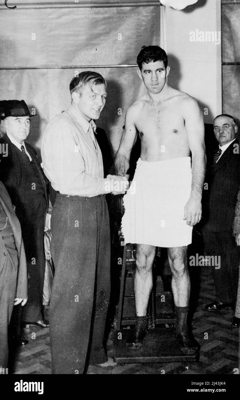 Strickland And Neusel Weigh In For Big Fight -- Walter Neusel (left) and Maurice Strickland on the scales at the weigh-in for the big fight