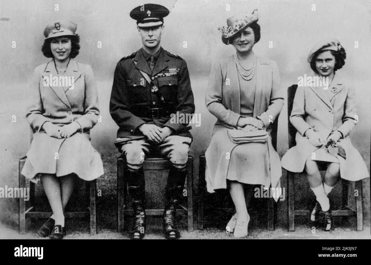 Britain's Royal Family -- A new and unpublished picture of their Majesties the King and Queen, with the two Princesses taken on the occasion of a visit to a Guards Depot, somewhere in England. October 23, 1942. (Photo by Fox Photos). Stock Photo