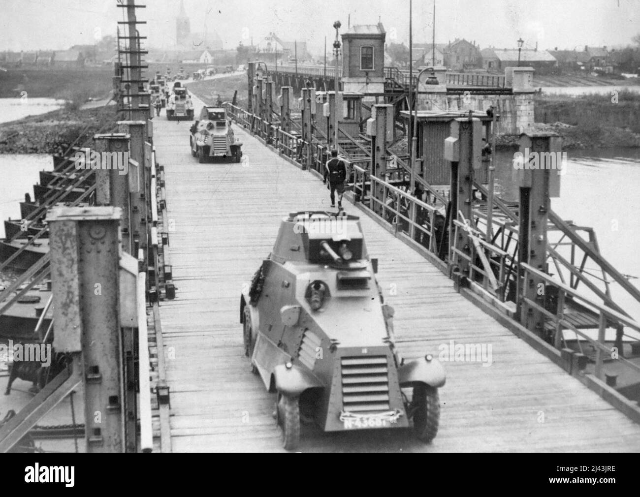 Holland Fortifies Her Frontier -- Dutch armored cars crossing the Hedel Bridge on their way to Hertogenbosch. April 3, 1936. (Photo by Wide World Photos). Stock Photo
