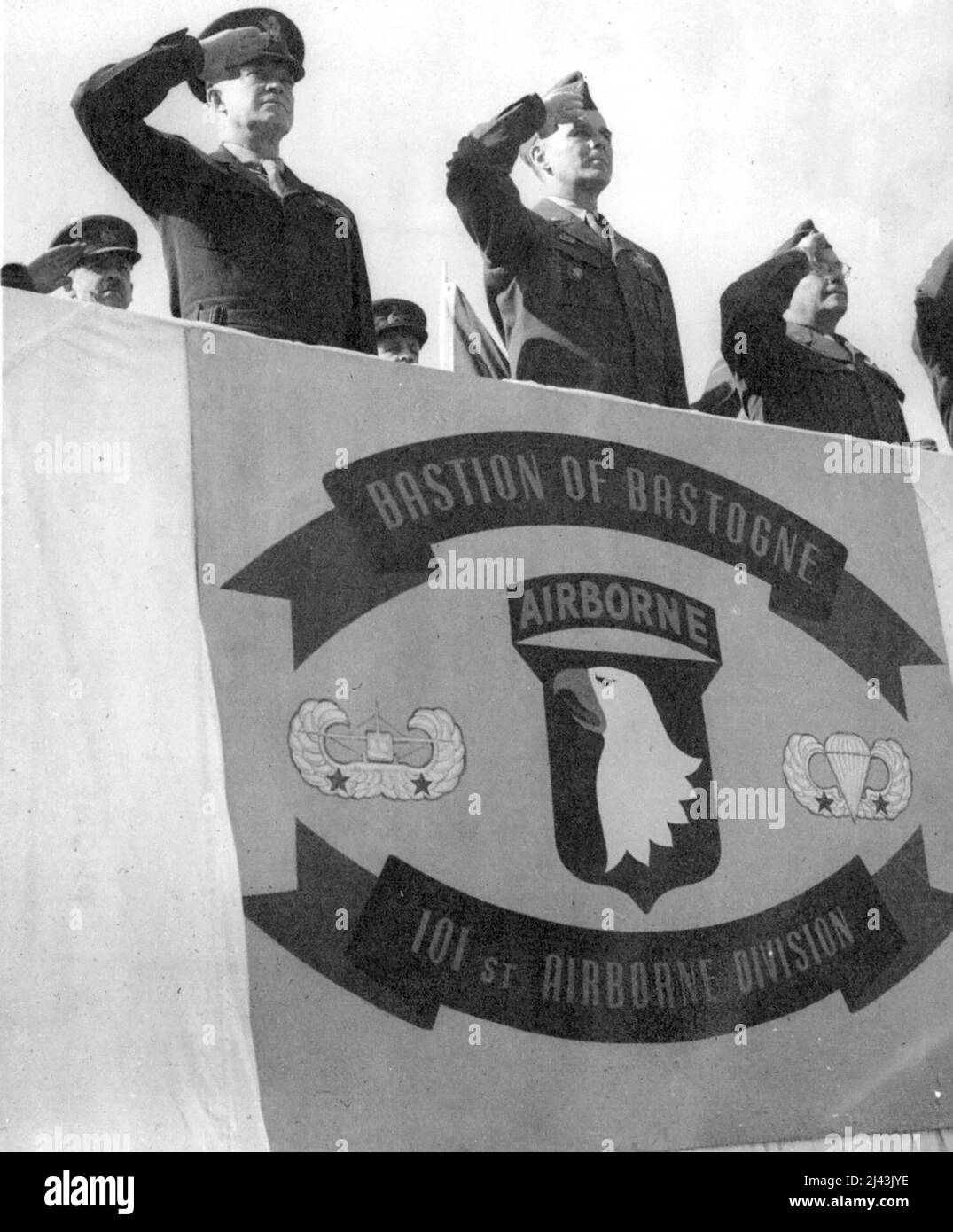 General Eisenhower Cites Airborne Division Left To Right General Eisenhower Major General Maxwell D Taylor Division Commander And General Lewis R Brereton Take The Salute In The Reviewing Stand During The Ceremony