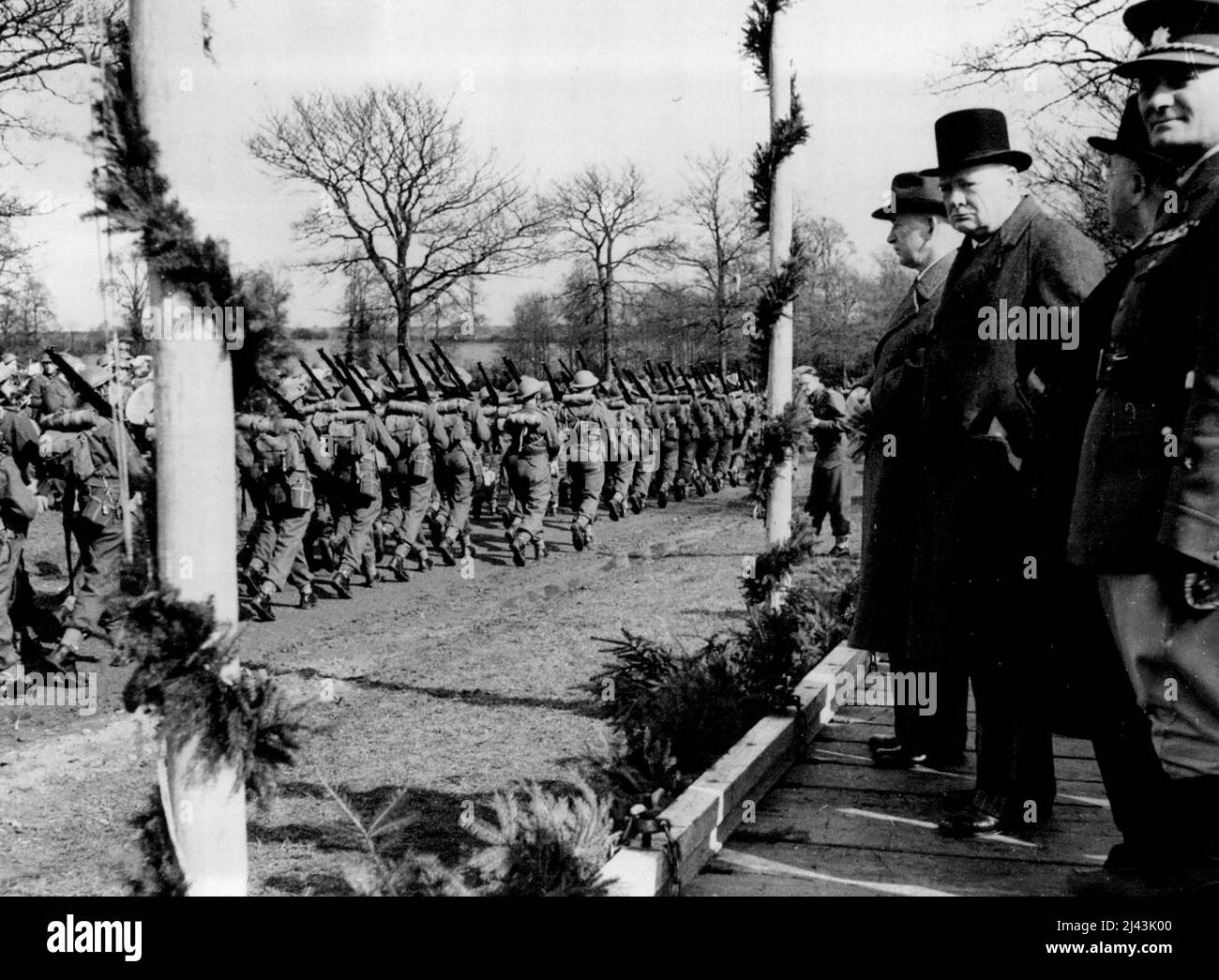 Prime Minister Visits Czech Troops -- The Prime Minister and Dr. Benes at the saluting base during the March past. The Prime Minister paid a visit to Czechoslovak troops in this country. He was accompanied by Mrs. Churchill, Dr. Benes (Czech President), Mgr. Sramer (Prime Minister of Czechoslovakia), Mr. Averell Harriman, President Roosevelt's personal representative, and Major General K. H. Arnold, Chief of the U.S. Army Air Corps. July 07, 1941. (Photo by British Official Photograph). Stock Photo