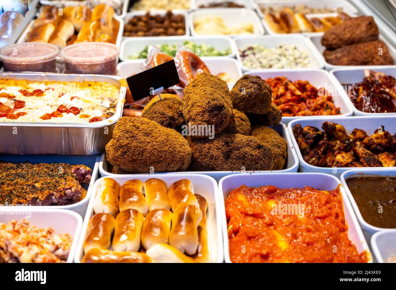 Assortment of gourmet meat dishes in butchery delicatessen shop, food