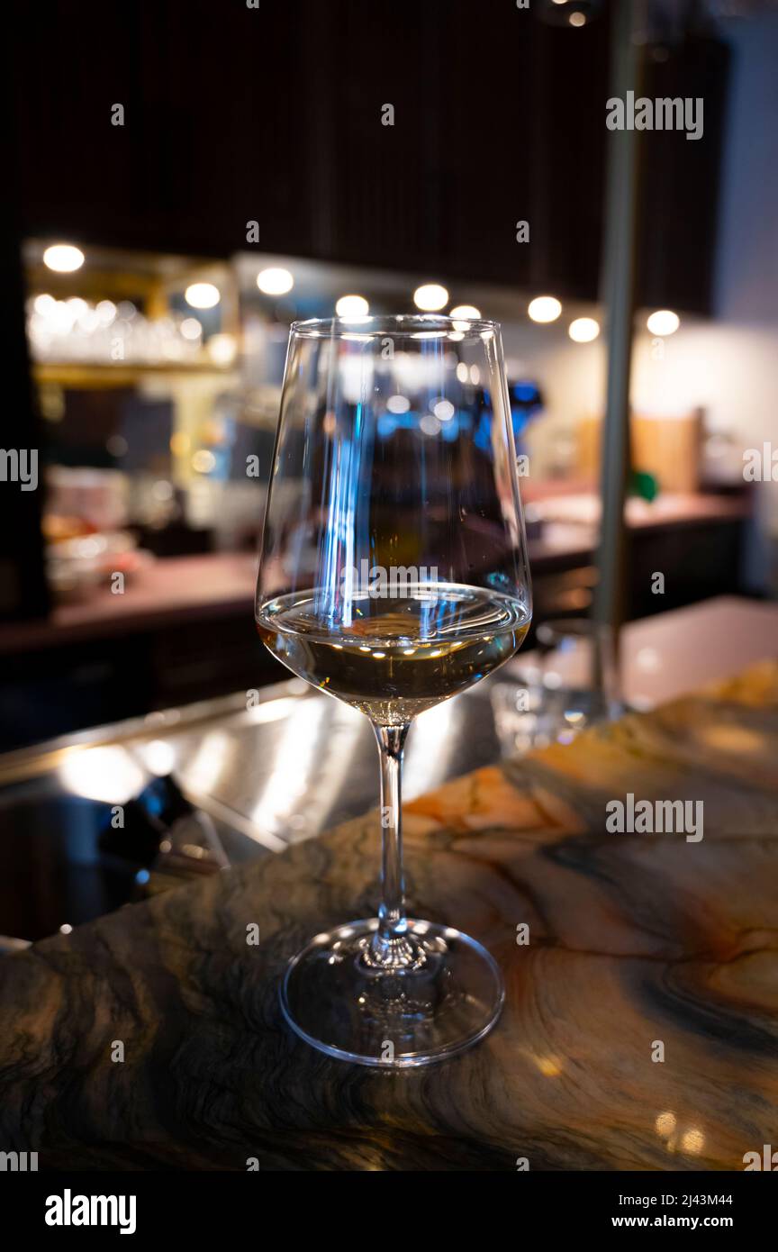 Glass of cold dry Italian pinot grigio white wine served in Italian bar