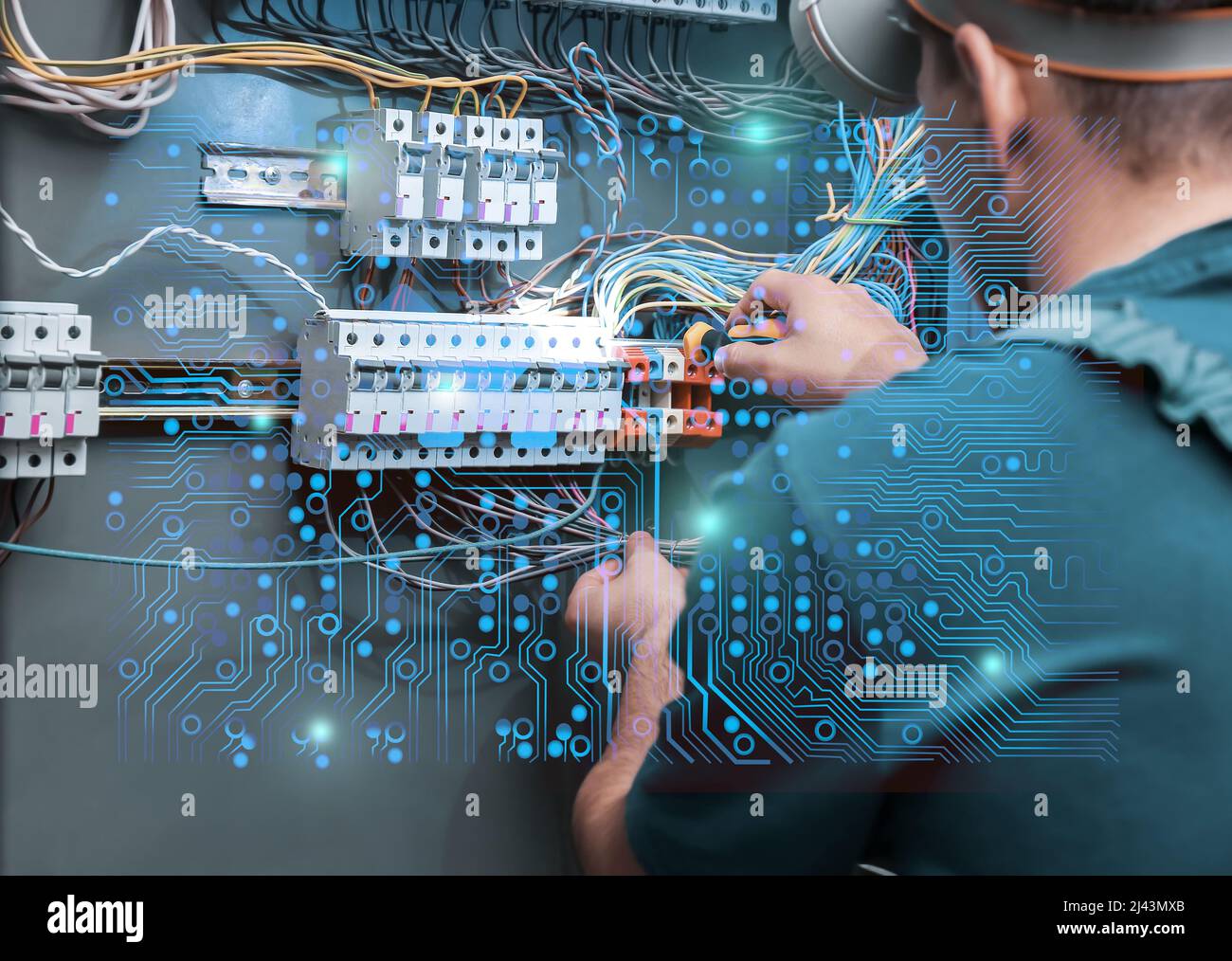 Electrician performing wiring in distribution board Stock Photo - Alamy