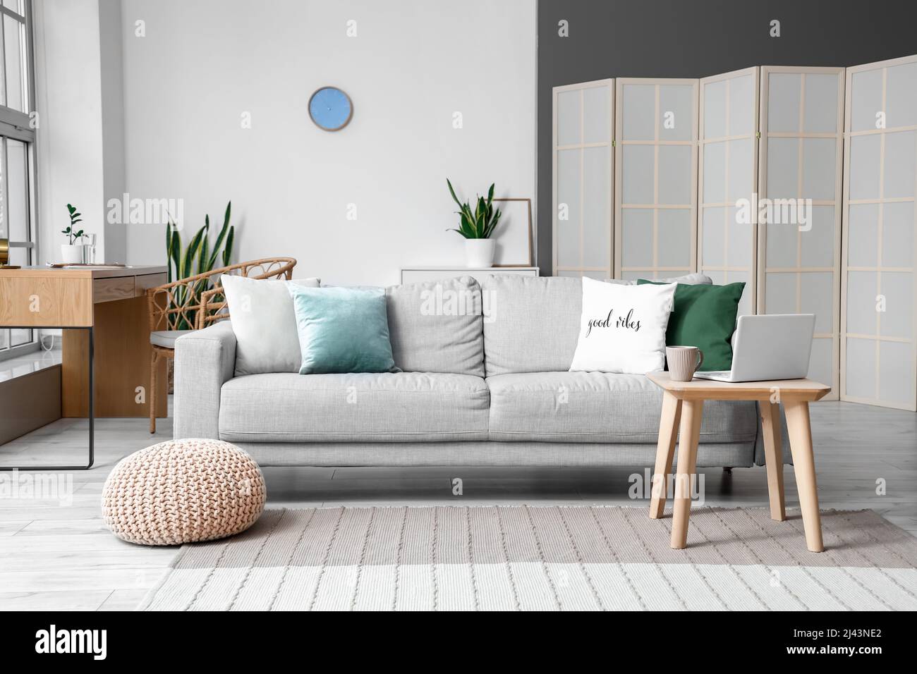 Interior of light living room with coffee table and sofa Stock Photo ...