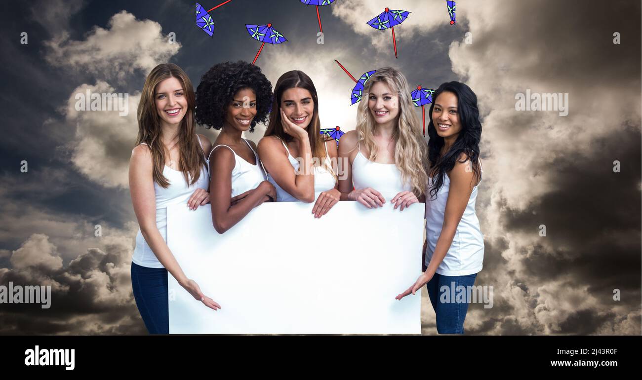 Group of diverse young women holding a blank placard with copy space ...