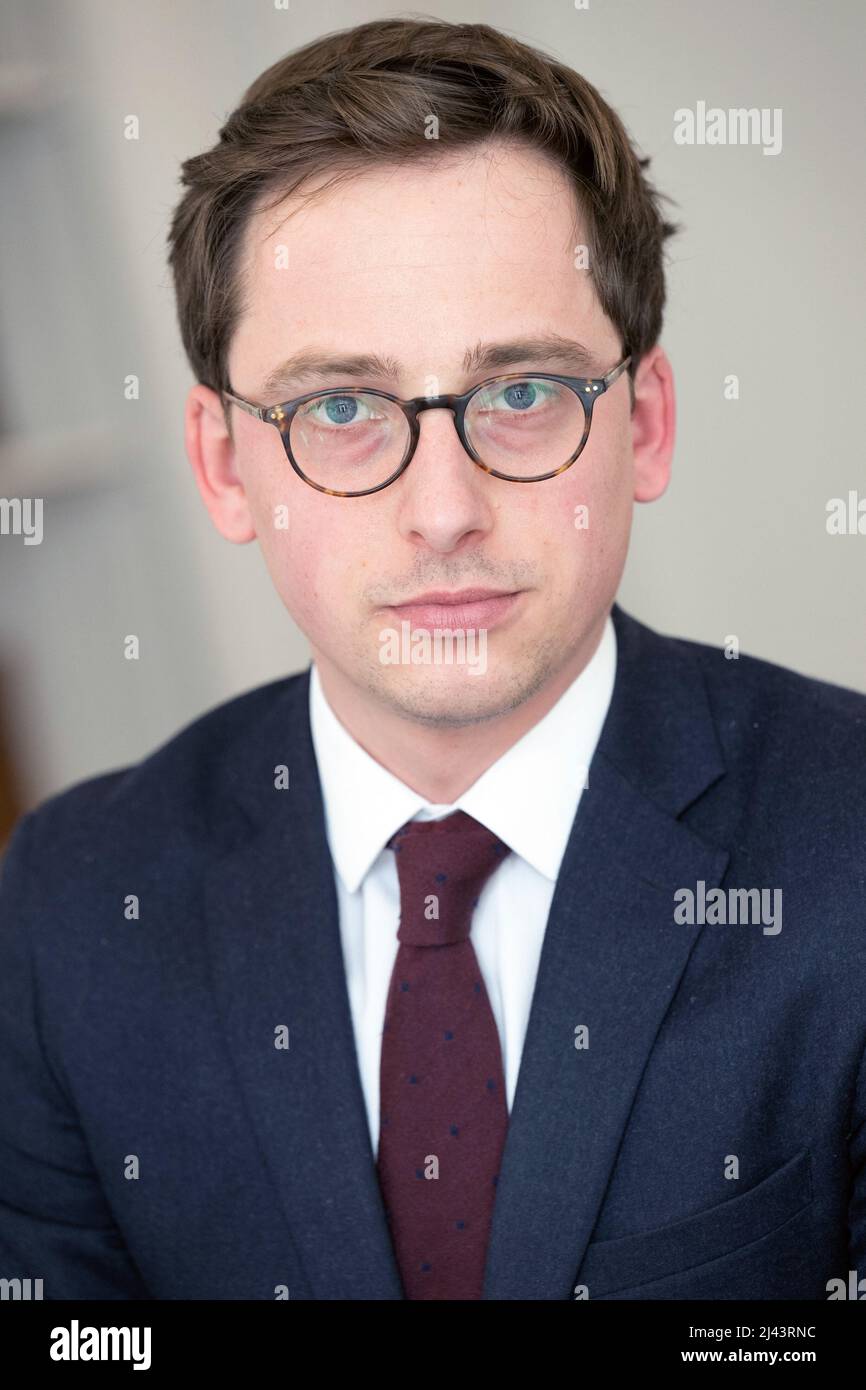 Lawyer Romain Dieudonne poses at her office, on March 21, 2022 in Paris