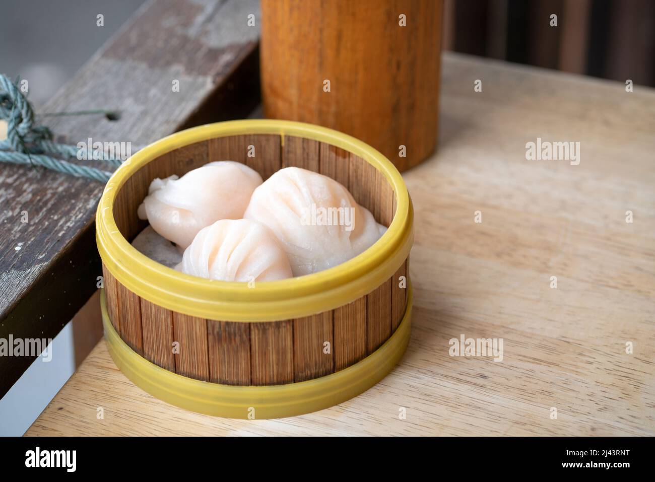 Dim sum Har Gao in bamboo steamer. Yum cha, Chinese cuisine. Stock Photo