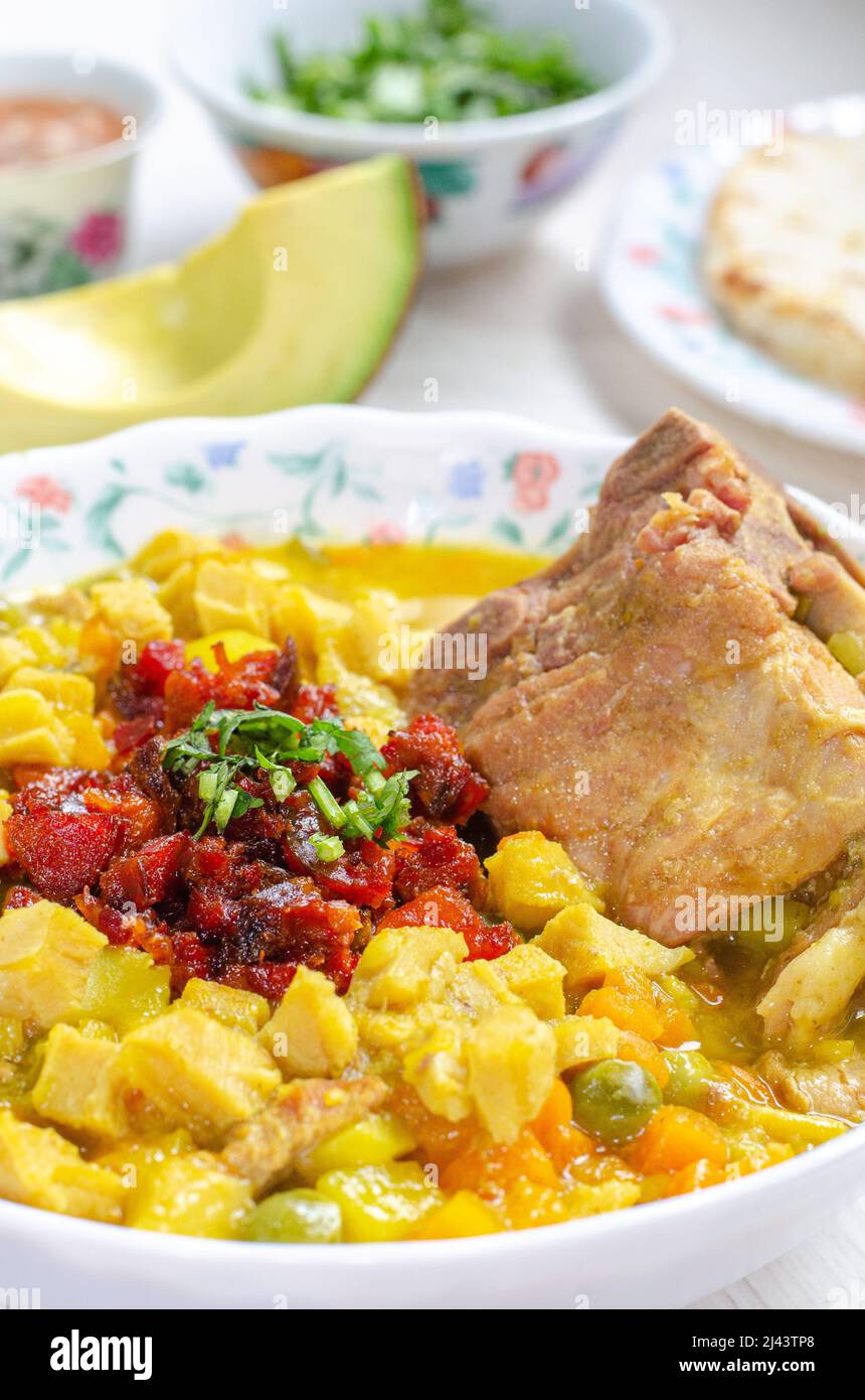 Tripe (stomach pig or cow)  soup, called mondongo, traditional food from Colombia.Callos, guatita, tripa mishque, pancita. Slow cooked. Backbone pork. Stock Photo