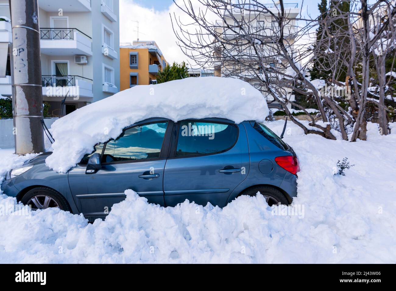 ATHENS, GREECE January 25, 2022 Cars totally covered with snow in